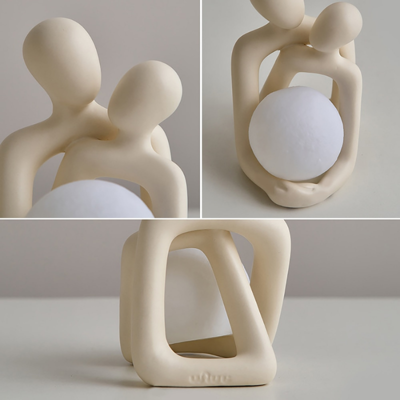 Captivating Couple Sculpture with Luminous Ball