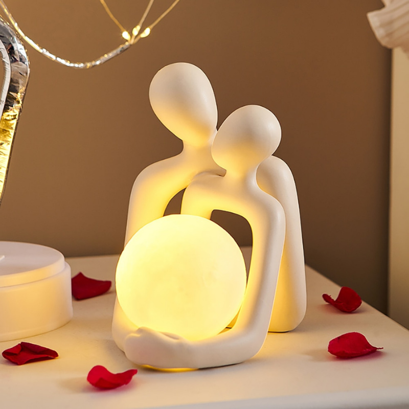 Captivating Couple Sculpture with Luminous Ball