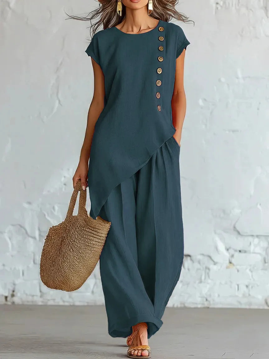 A round-neck, asymmetrical short-sleeved top and wide-leg trousers set with wooden buttons