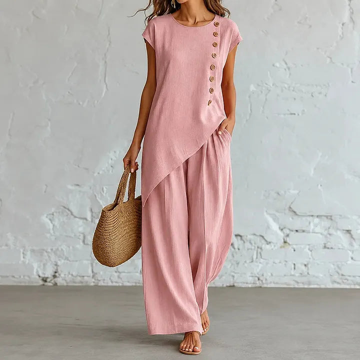 A round-neck, asymmetrical short-sleeved top and wide-leg trousers set with wooden buttons