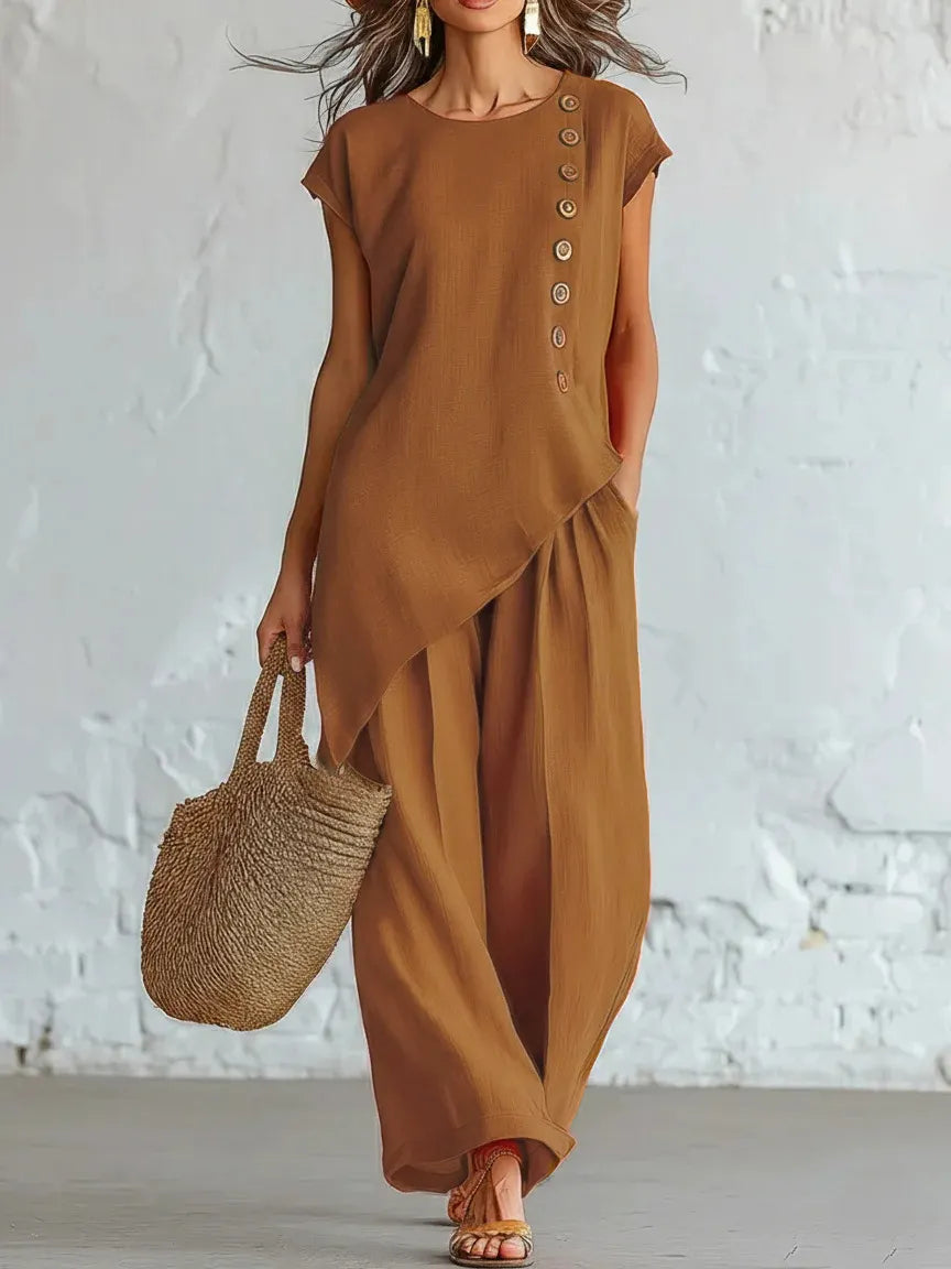 A round-neck, asymmetrical short-sleeved top and wide-leg trousers set with wooden buttons