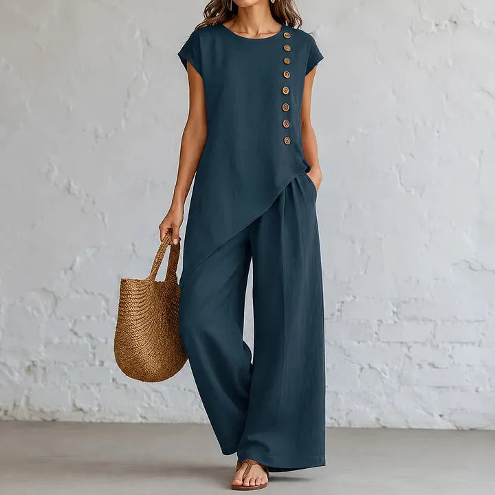 A round-neck, asymmetrical short-sleeved top and wide-leg trousers set with wooden buttons