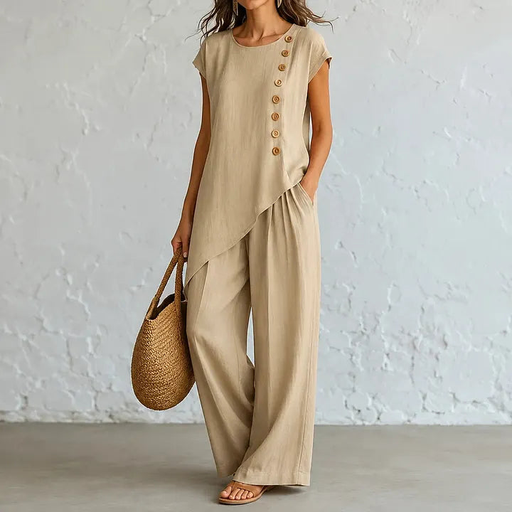 A round-neck, asymmetrical short-sleeved top and wide-leg trousers set with wooden buttons