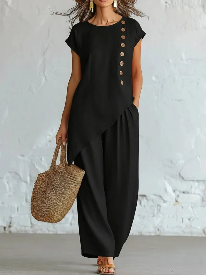 A round-neck, asymmetrical short-sleeved top and wide-leg trousers set with wooden buttons