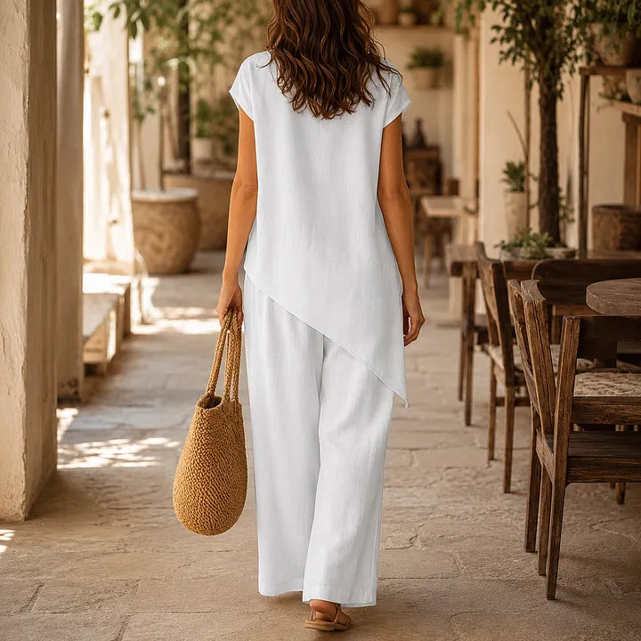 A round-neck, asymmetrical short-sleeved top and wide-leg trousers set with wooden buttons