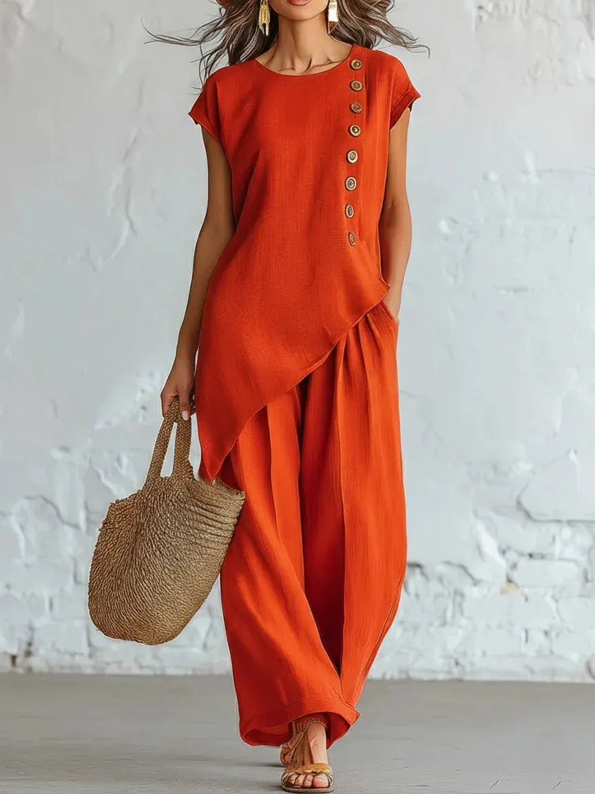 A round-neck, asymmetrical short-sleeved top and wide-leg trousers set with wooden buttons