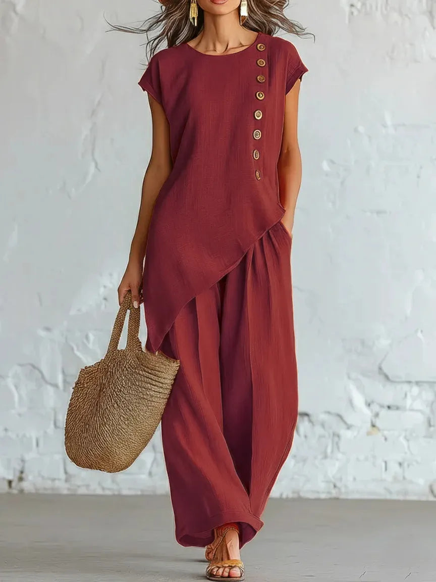 A round-neck, asymmetrical short-sleeved top and wide-leg trousers set with wooden buttons