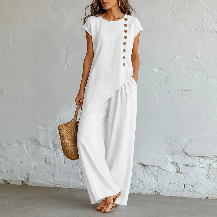 A round-neck, asymmetrical short-sleeved top and wide-leg trousers set with wooden buttons
